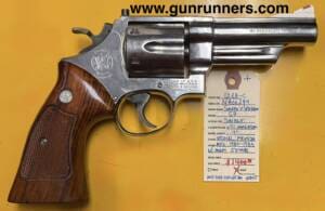 Smith & Wesson, used, Model 57, .41 Magnum caliber, nickel finish, “pinned & recessed”, 4” barrel, 6 shot, double action revolver, manufactured 1980-1983, with Pelican hard case, 5 boxes ammo, Aimpoint red dot sight.   This revolver is missing its rear sight.