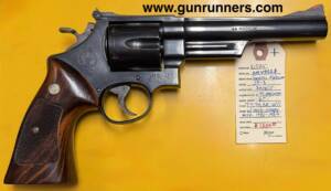 Smith & Wesson, used, Model 29-3, .44 Magnum caliber, “Dirty Harry” gun, double action revolver, 6” barrel, blued finish, target hammer, target trigger, red ramp front sight, white outline rear sight, 6 shot, manufactured 1985-1987.   This revolver does not have the “Hillary Hole”.